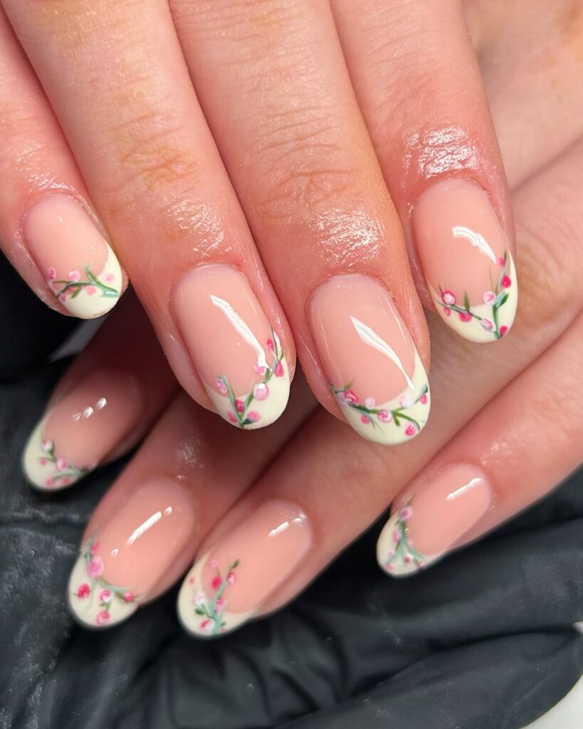 Cream French tips with pink cherry blossom branches