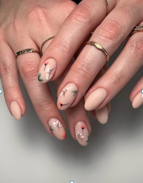 nude spring nails with flower accents