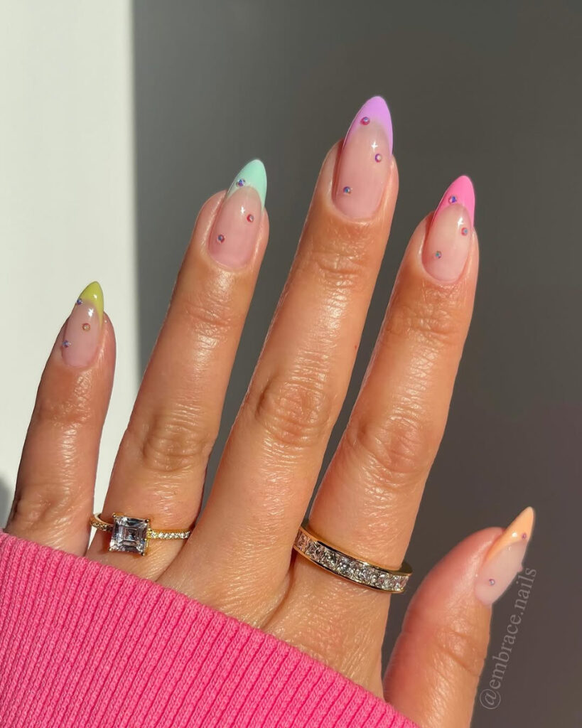 Pastel rainbow French tips with rhinestone gems