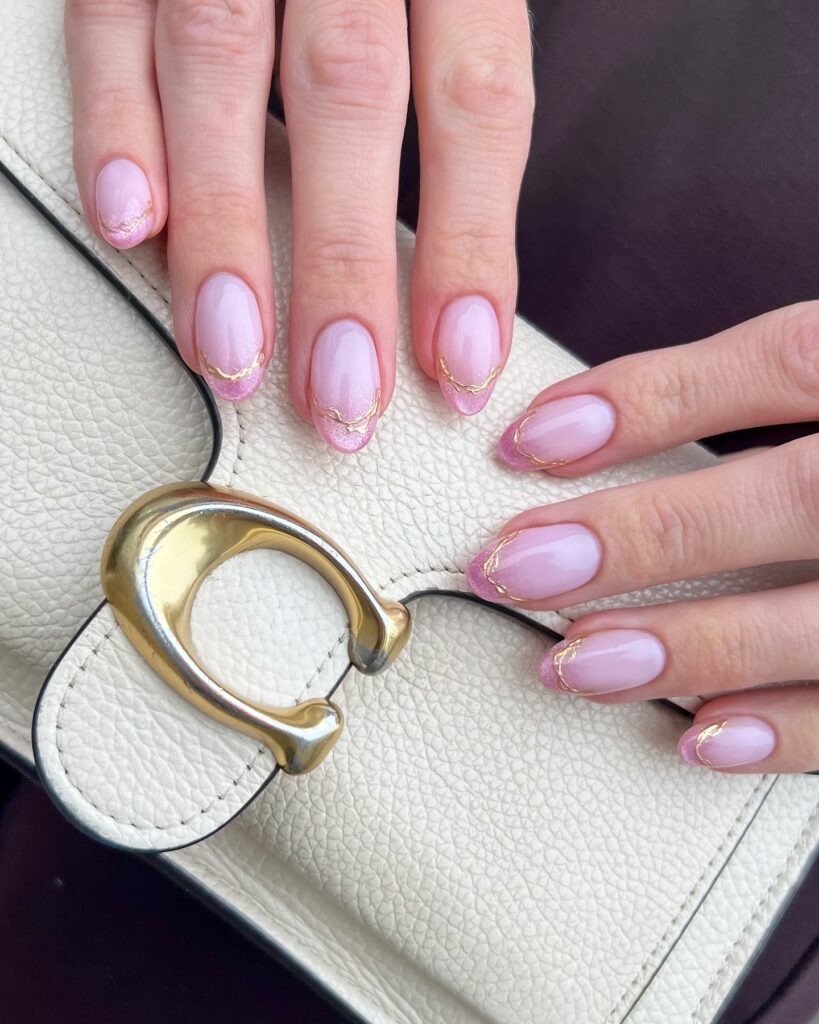 pink shimmer French tips with gold line