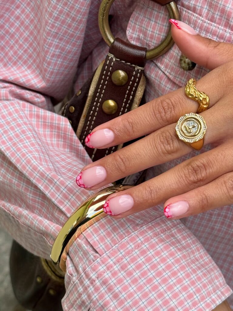 pink nails with scalloped red French tips