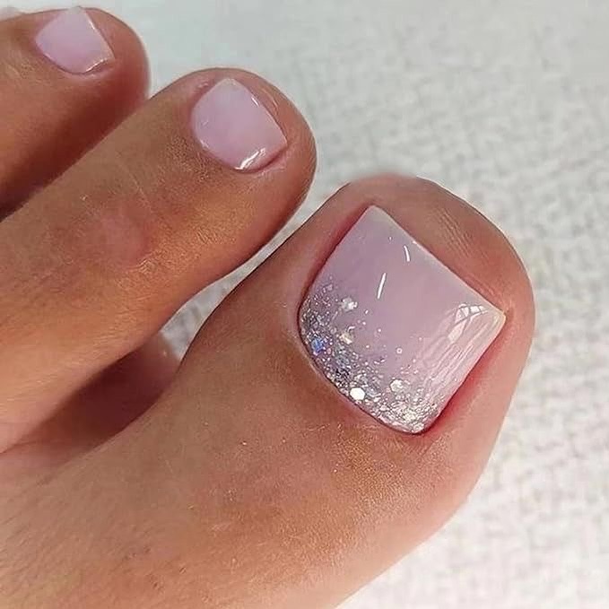 soft lilac pedicure with silver glitter fade