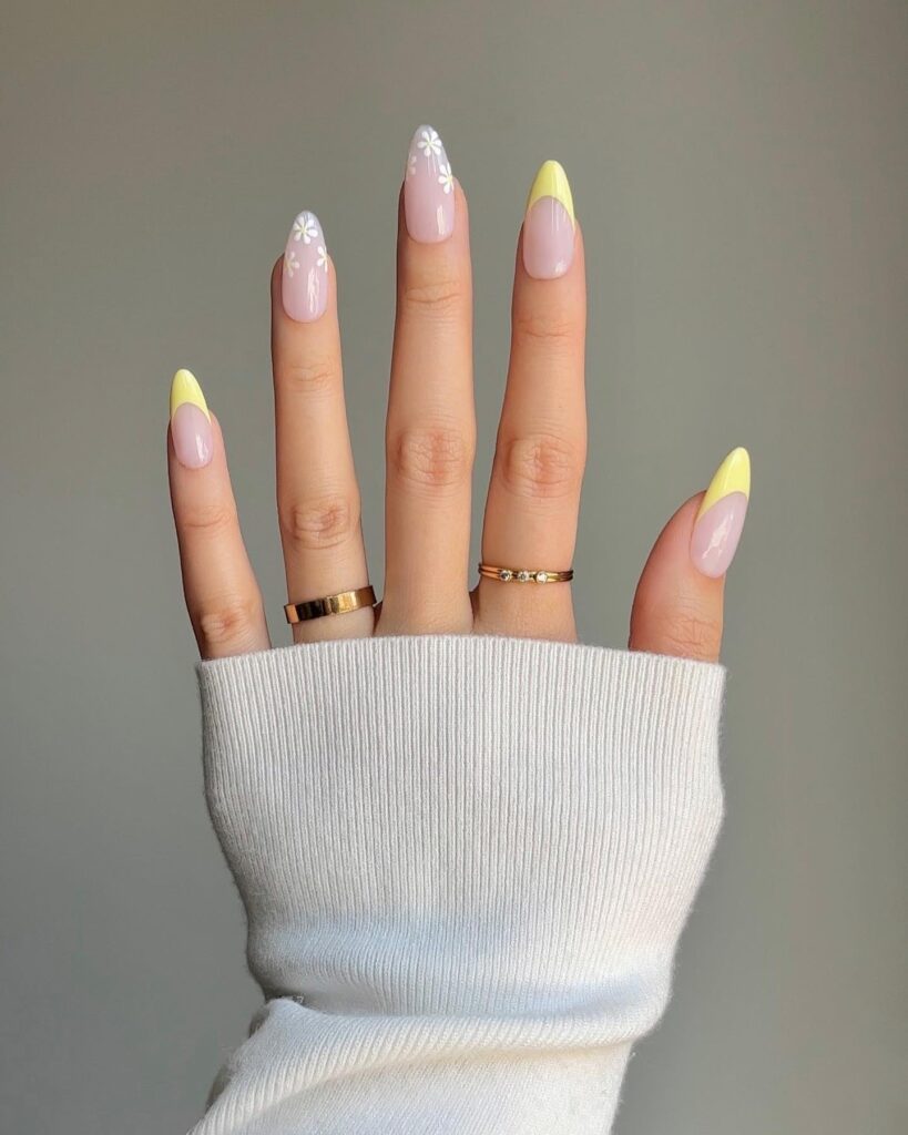 yellow French tips with daisy accent