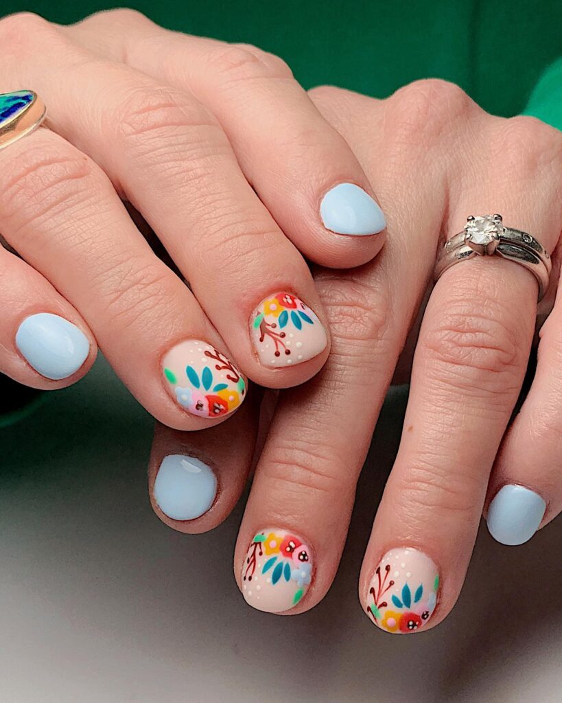 Sky blue nails with boho floral accent art