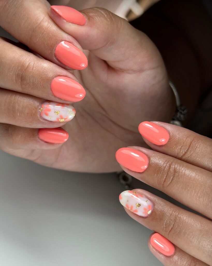 Coral nails with gold foil accent nail