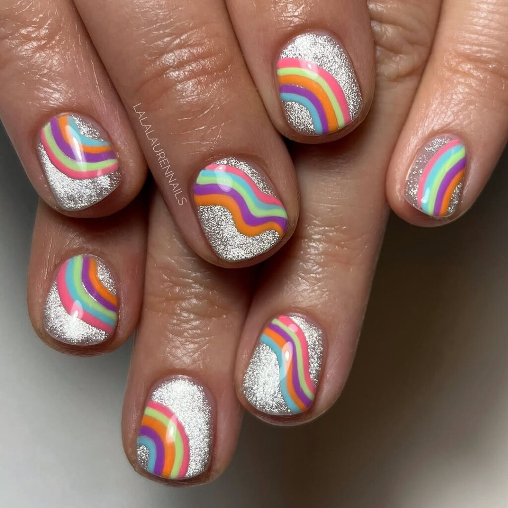 Silver glitter nails with neon rainbow wave art