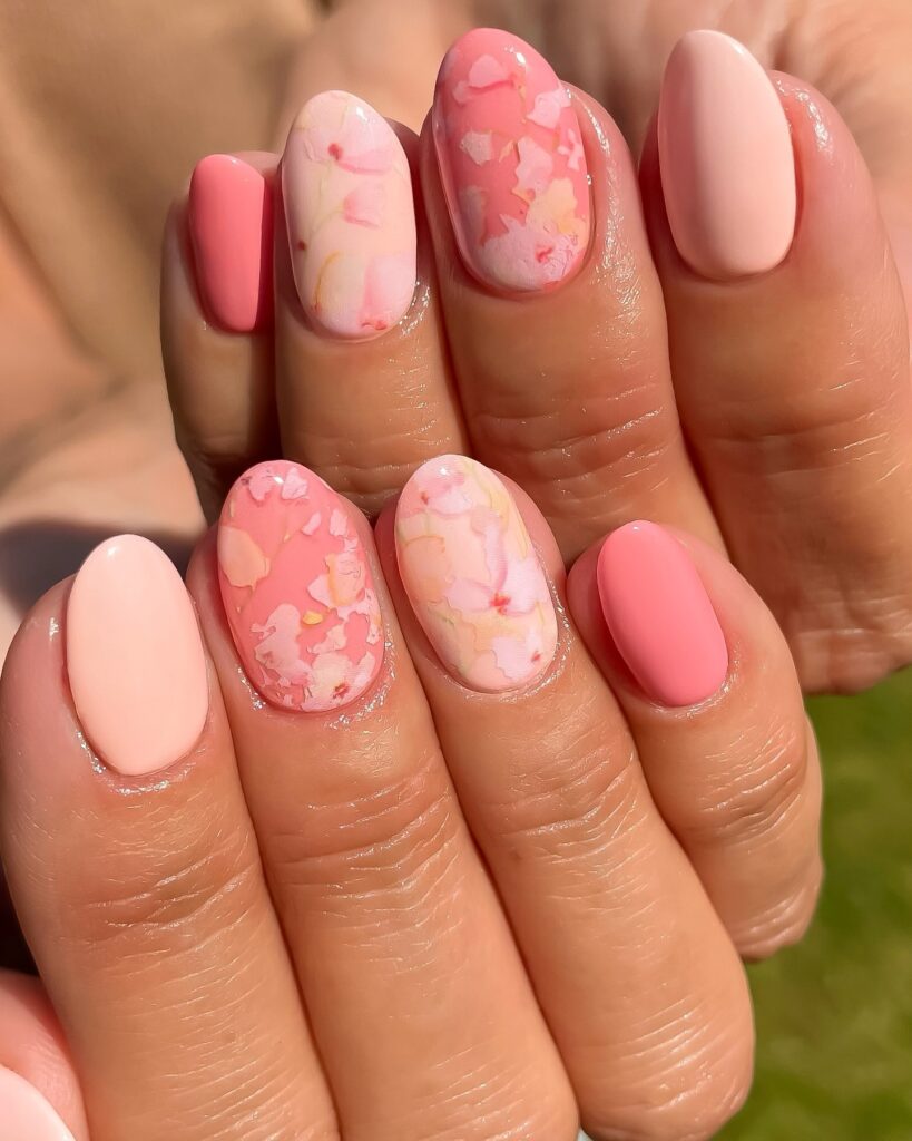 Coral pink nails with marble petal accent