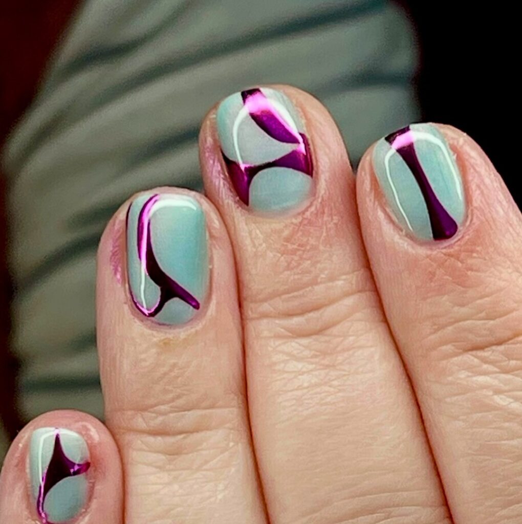 Mint green nails with magenta swirl art