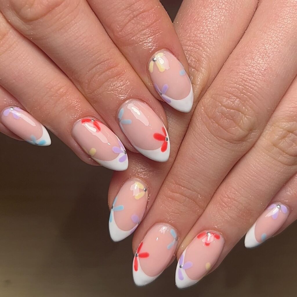 White French tips with coral wildflower nail art