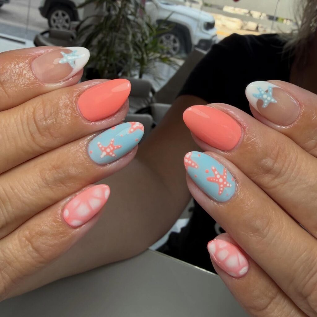 Coral and baby blue nails with starfish nail art
