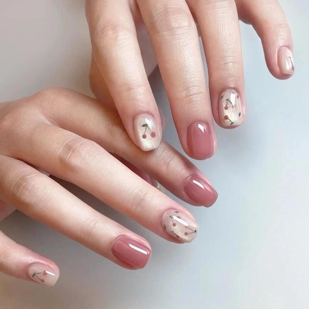 Dusty rose nails with cherry art accent