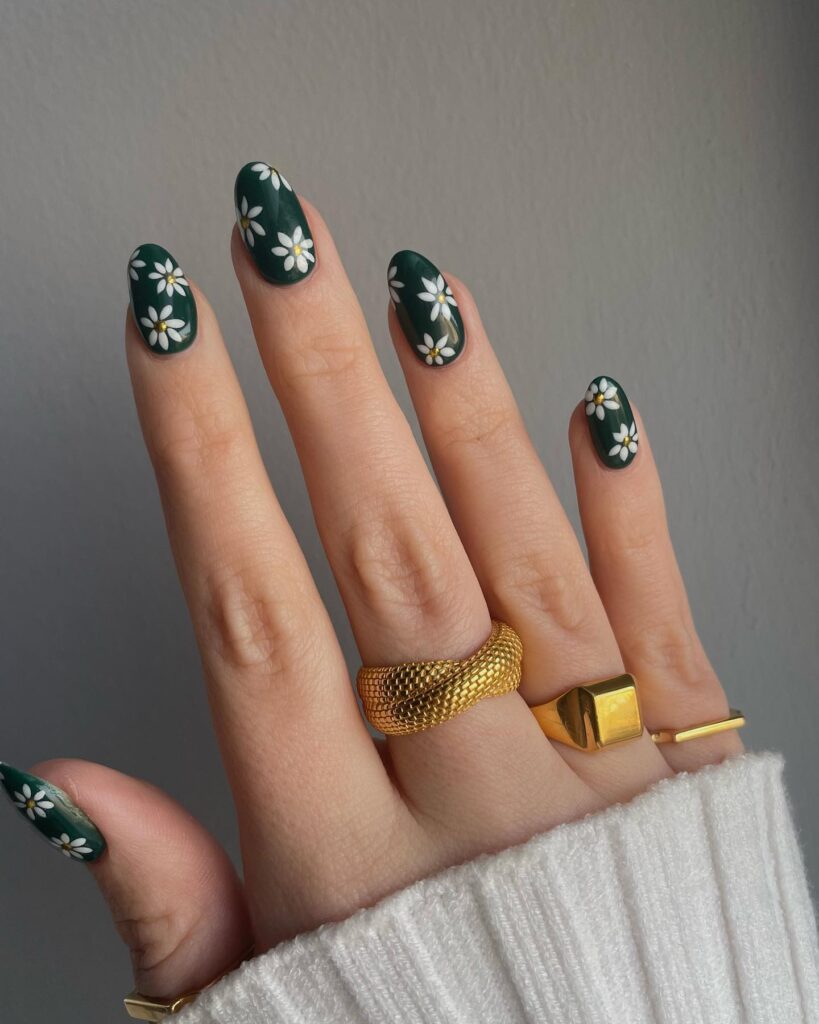 Dark green nails with white daisy art