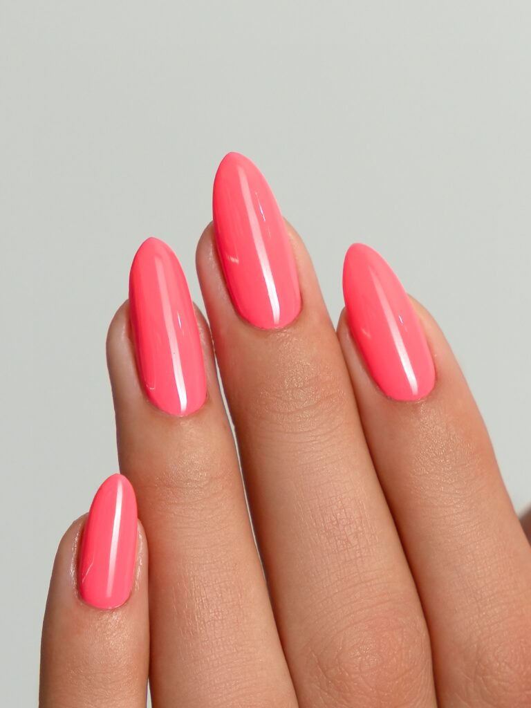 Glossy coral pink almond nails