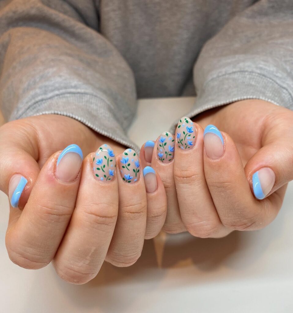 Blue French tips with tulip floral nail art