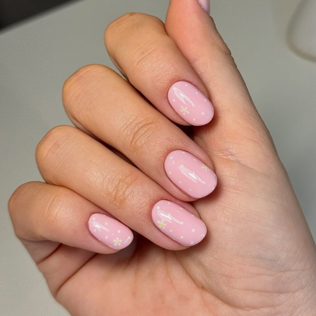 Baby pink nails with tiny white daisy art
