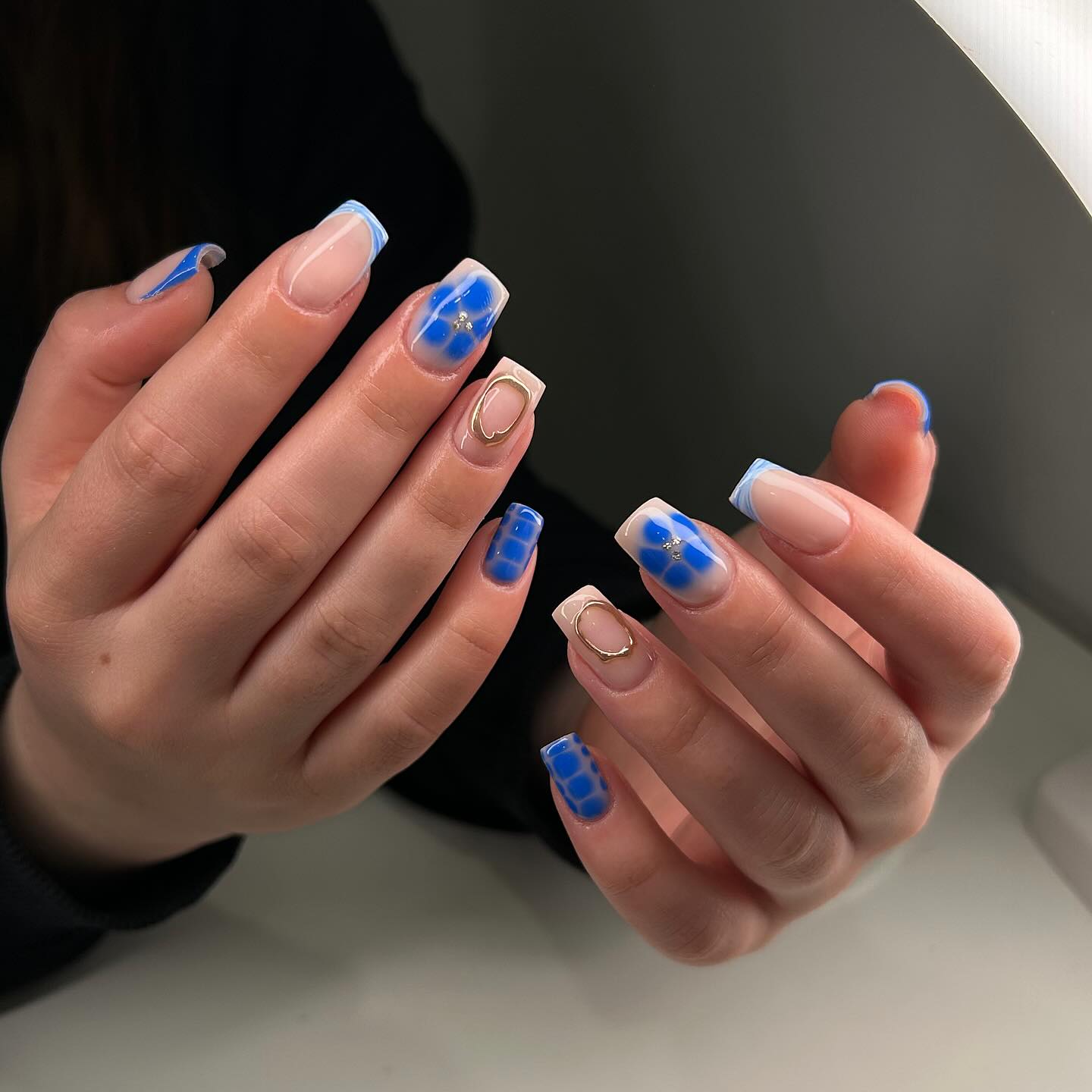 Blue daisy French tip nails