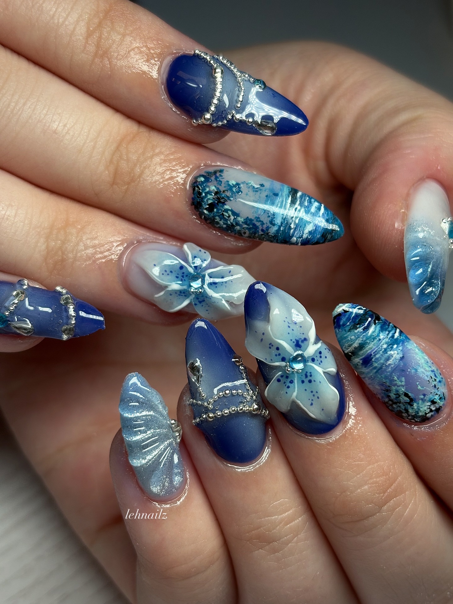 Bold blue geometric French tip nails