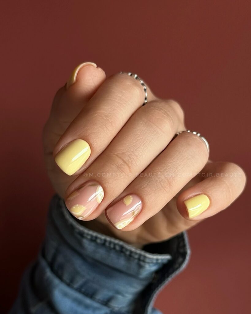 butter yellow nails with a nude accent