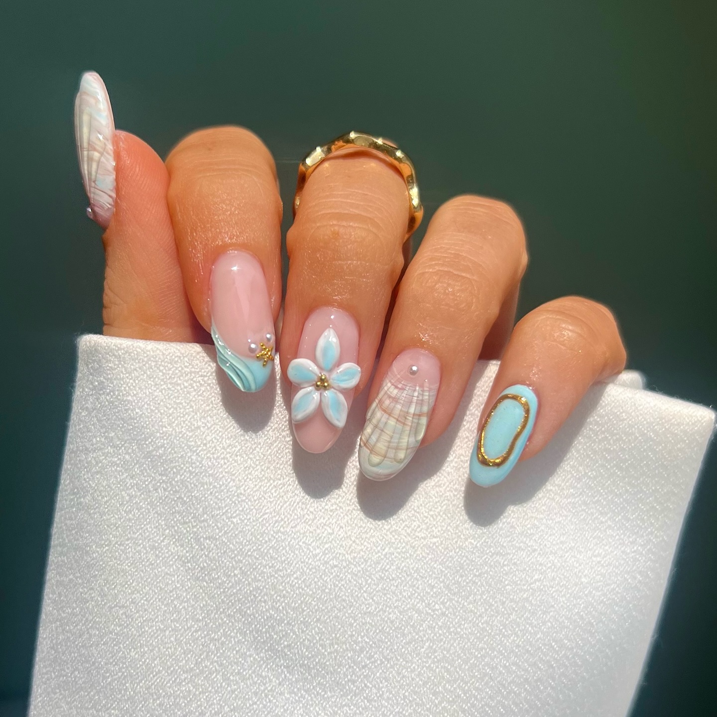 Almond nails with 3D plumeria flower and seashell art