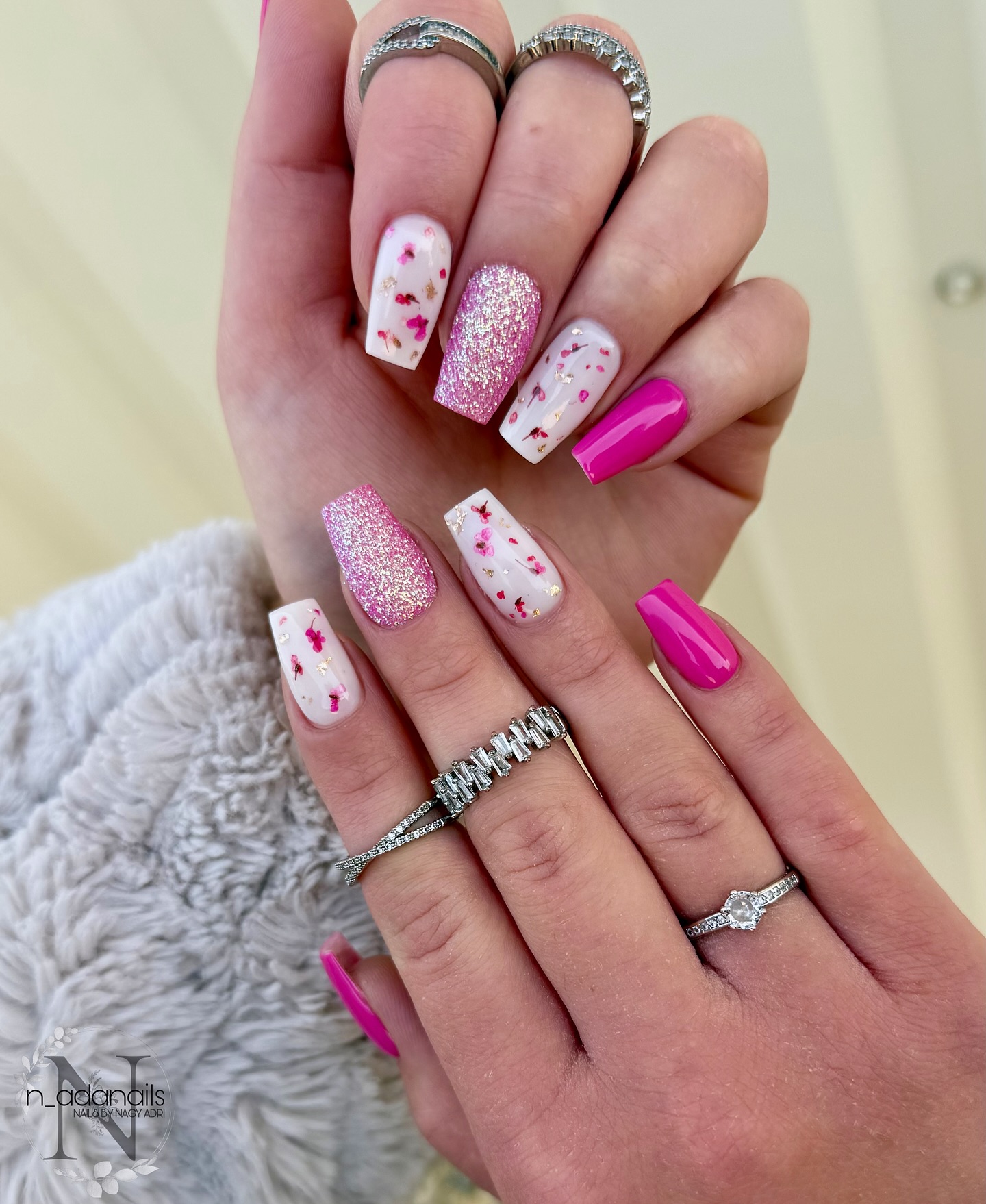 Long coffin nails with hot fuchsia iridescent pink glitter and white pressed dried florals