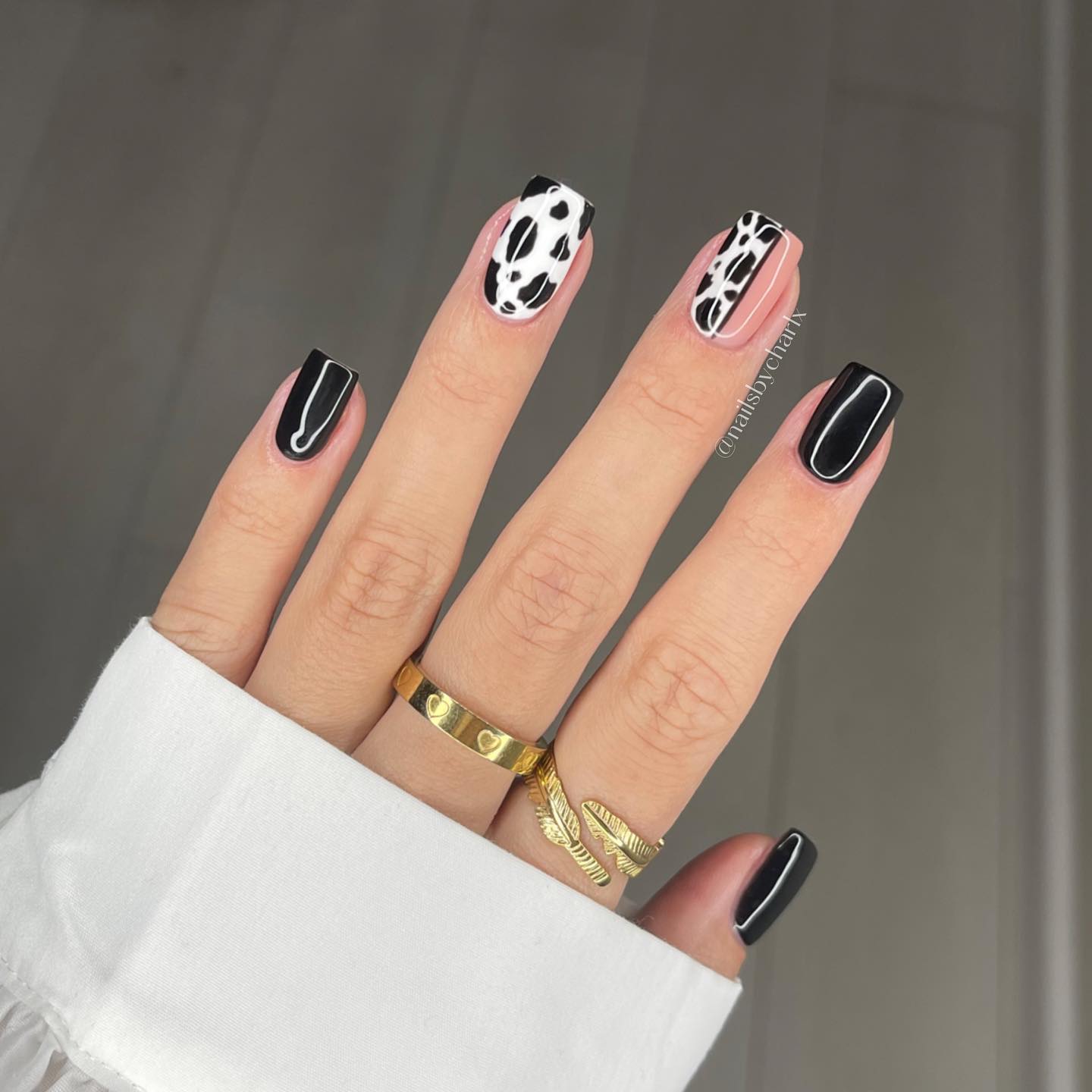 Cow print nails mixed with solid black