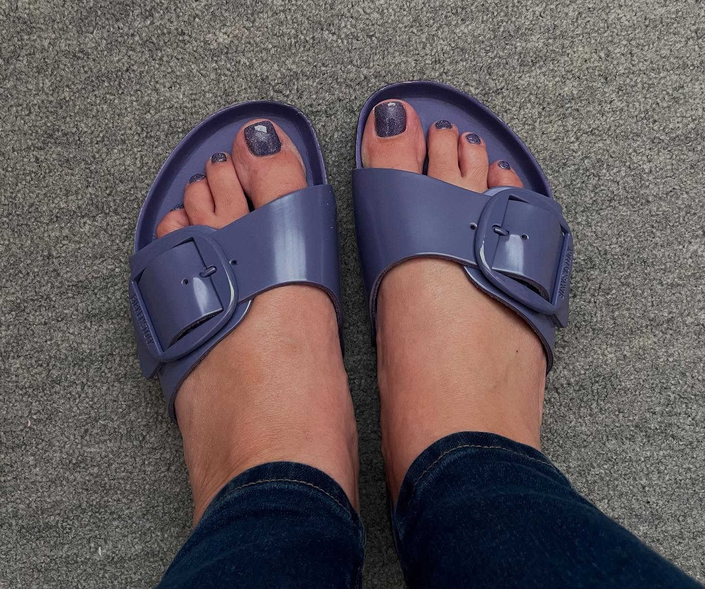 Dusty purple glitter gel toe nails worn in matching purple Birkenstock sandals