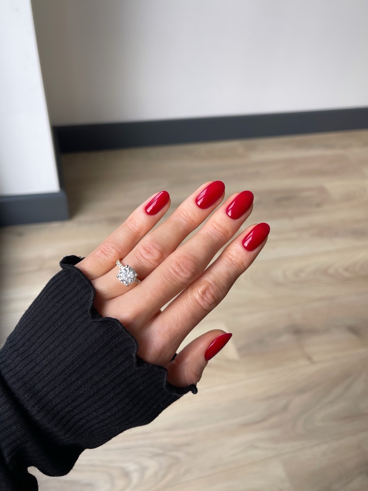 Glazed almond nails in warm scarlet