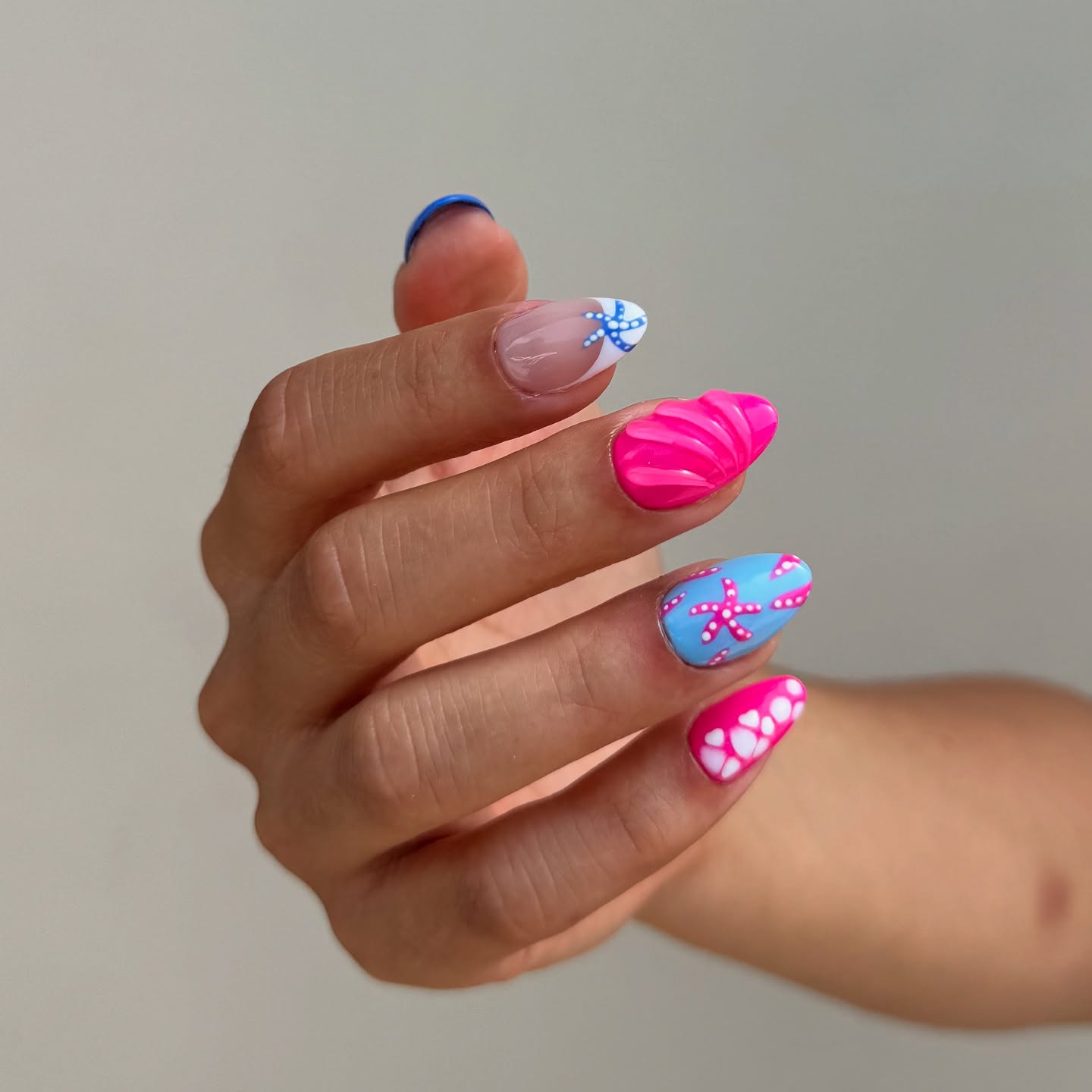 Hot pink 3D seashell nails with sky blue starfish design