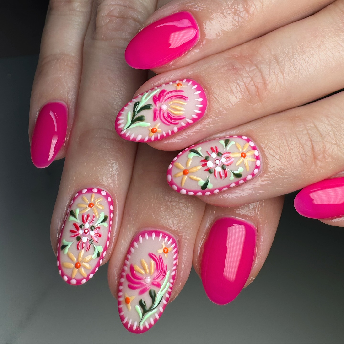 Hot pink nails with embroidery style tropical floral accent art