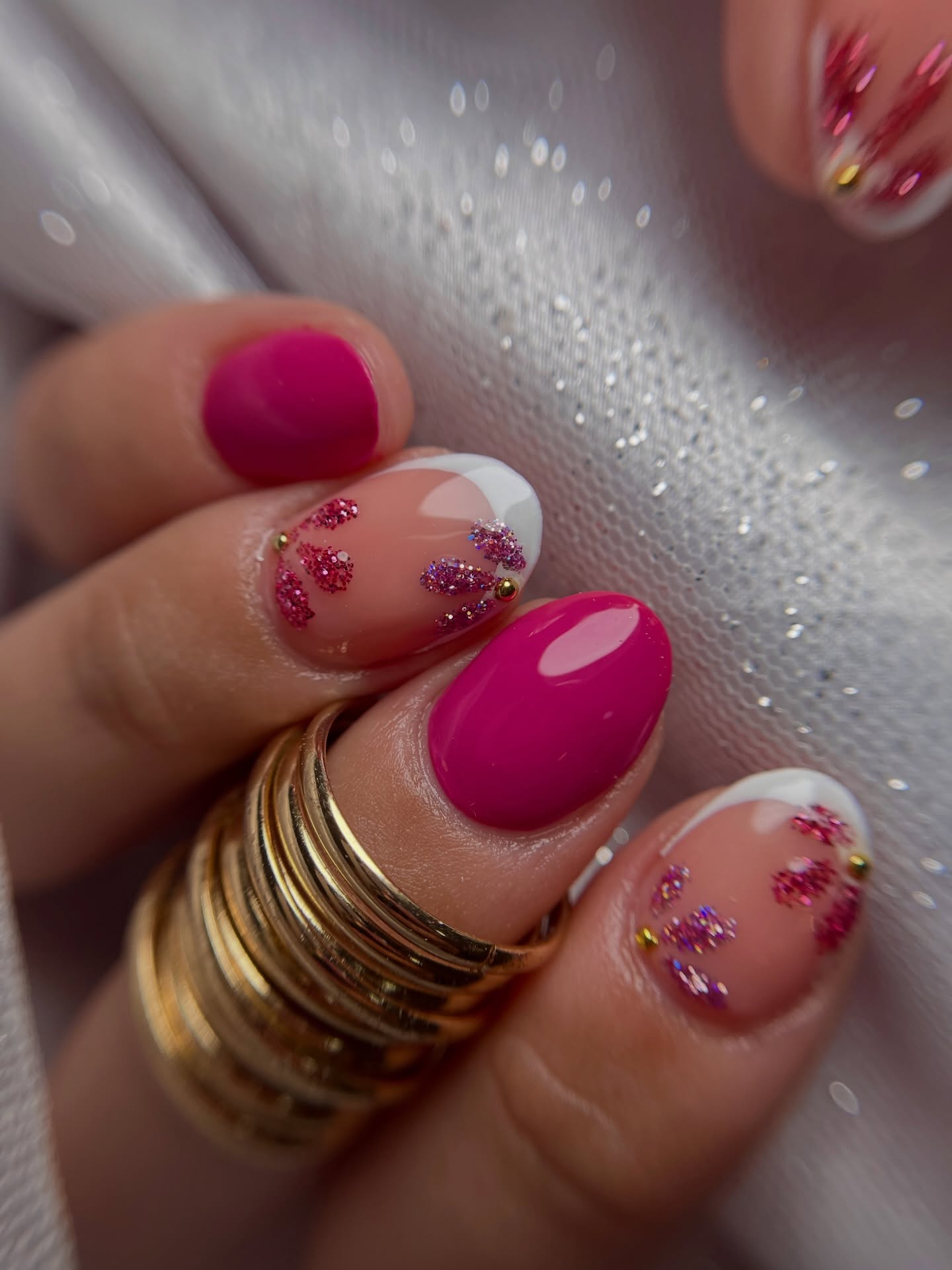 Hot pink nails with glitter flower French tips