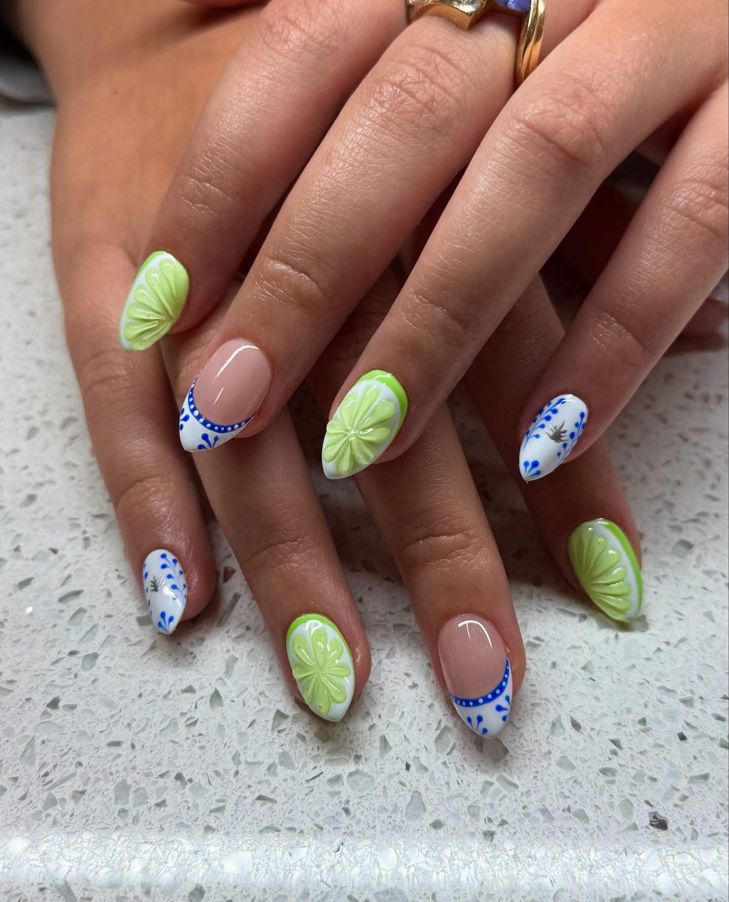 Almond nails with 3D lime slice and blue Talavera tile art