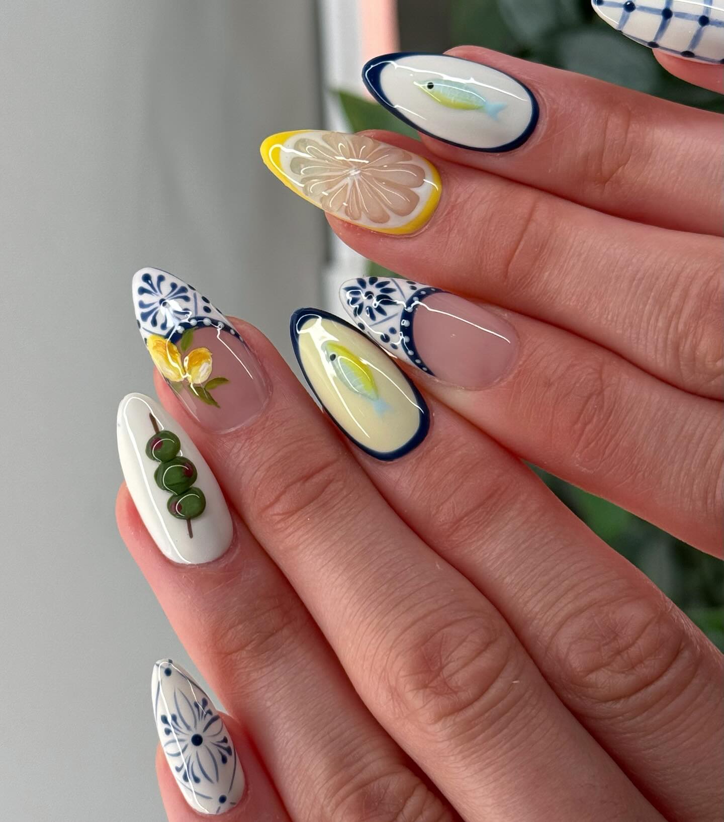 White almond nails with blue tile olive lemon and fish mismatch