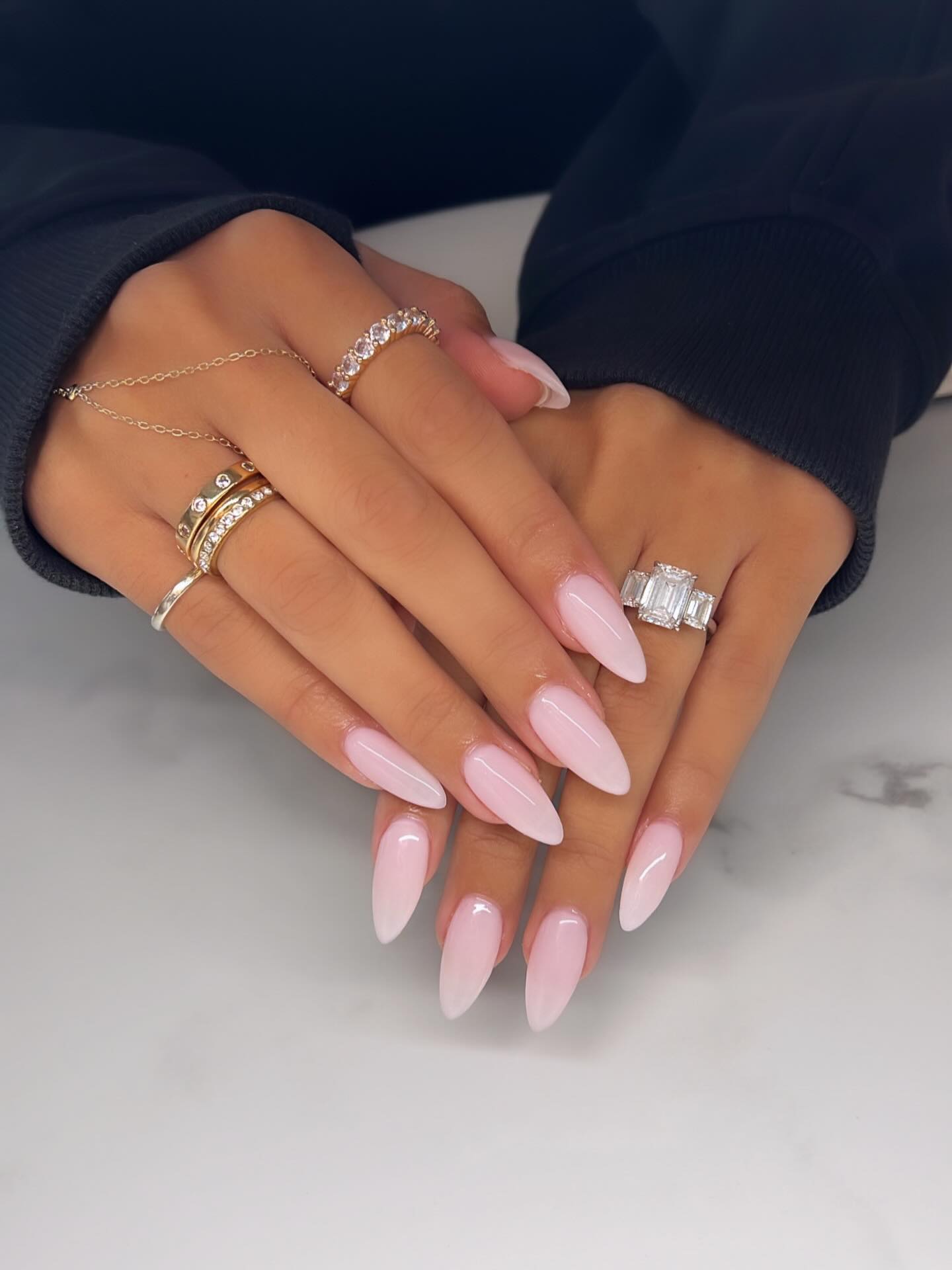 Long milky baby pink stiletto nails with high gloss finish