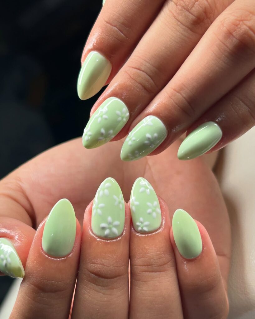 Almond mint green nails with raised white 3D daisy flowers