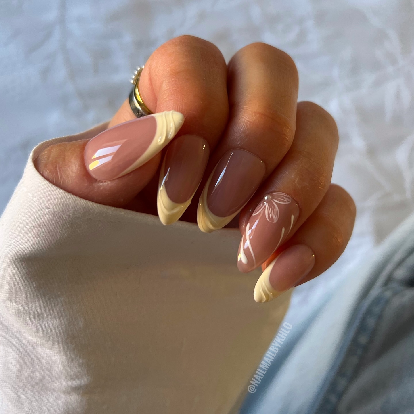Mocha almond nails with butter yellow French swirl