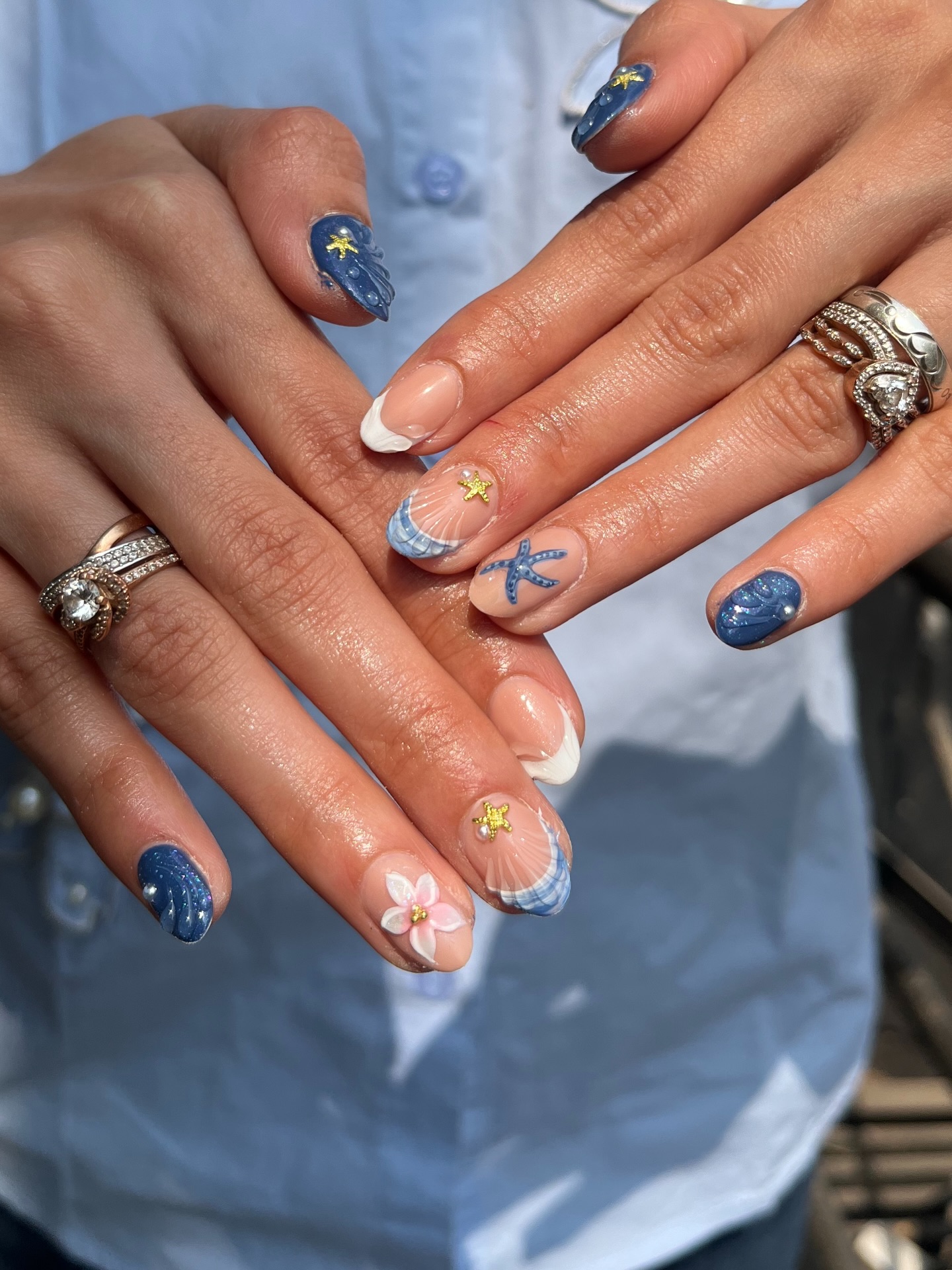 Navy almond nails with seashell starfish and sea turtle art
