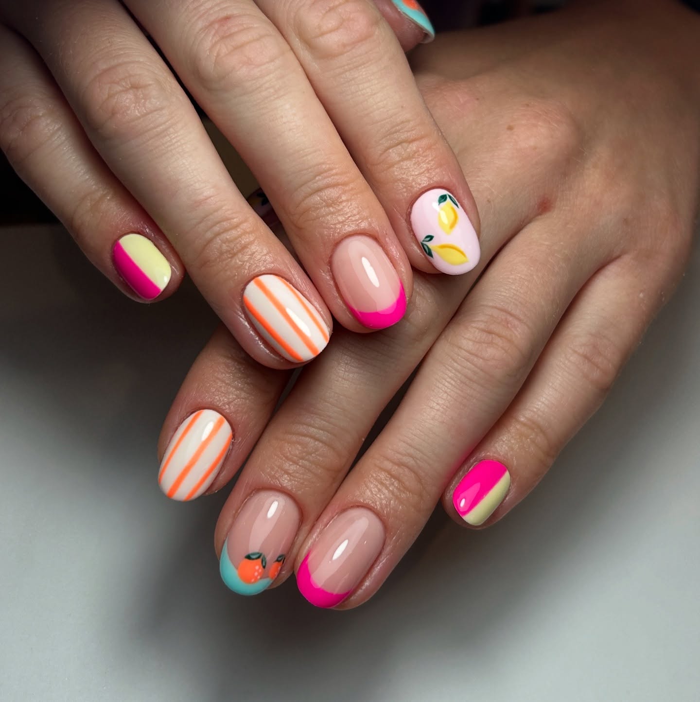 Neon tropical nails with orange stripes lemon and citrus art