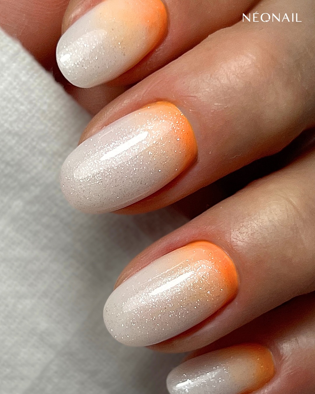 Orange shimmer ombre nails