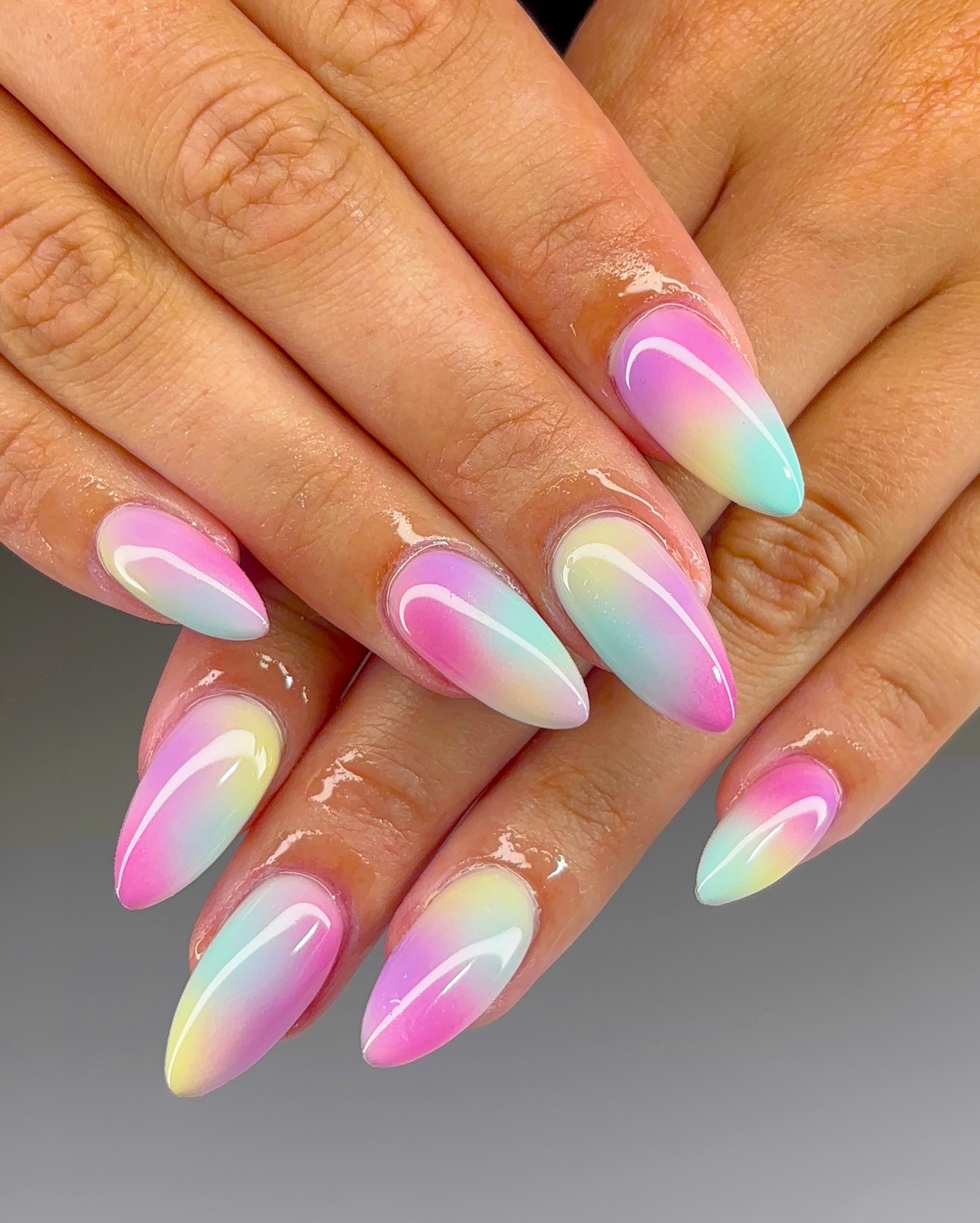 Pink mint and yellow aurora ombre almond nails