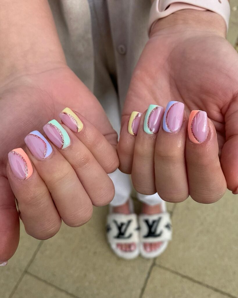 pastel colour-block nails divided by rose gold glitter arcs