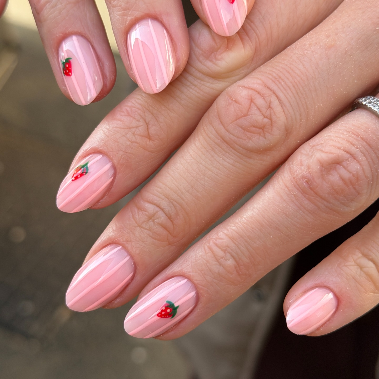 Pink floral nails on sheer base