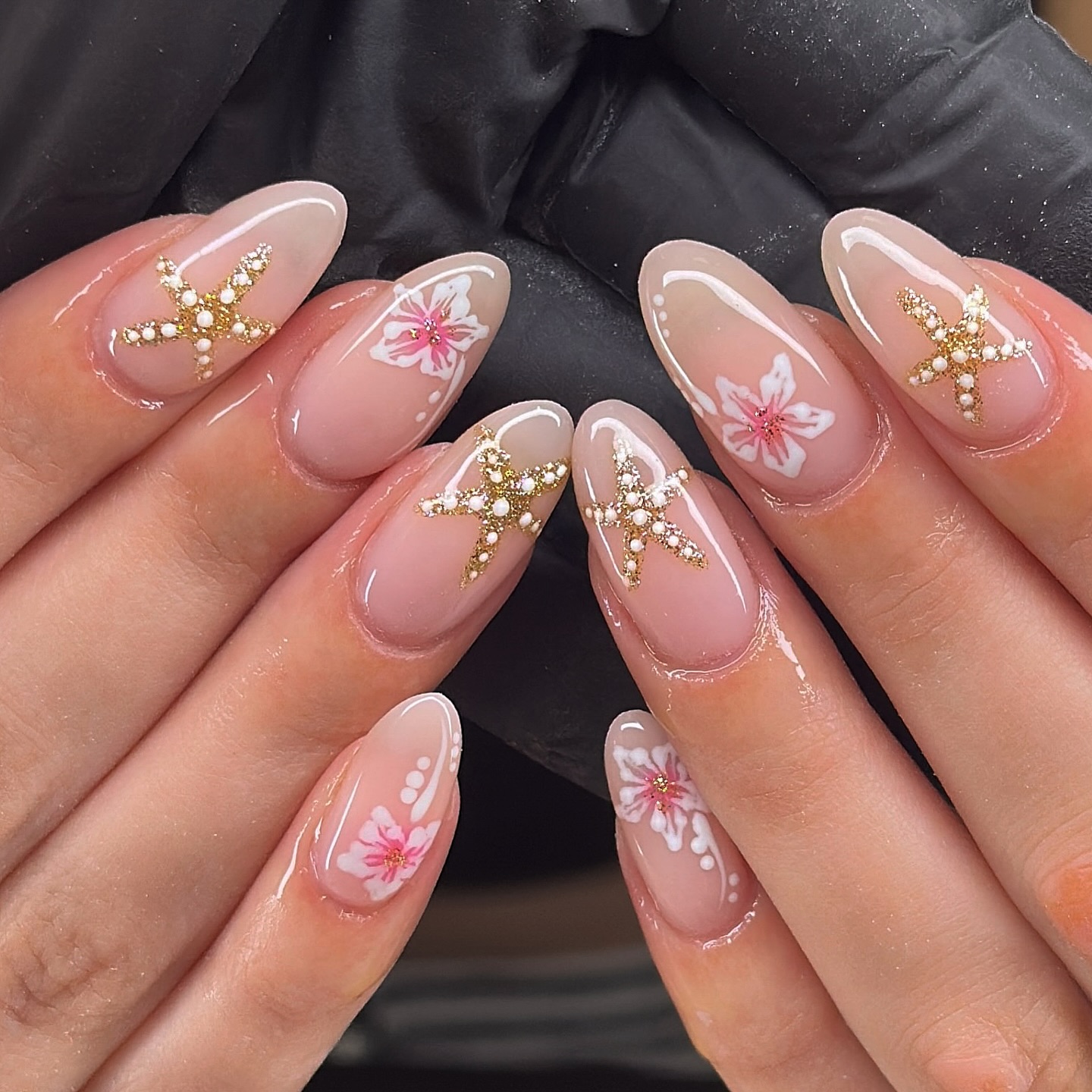 Pink French tip with floral accents