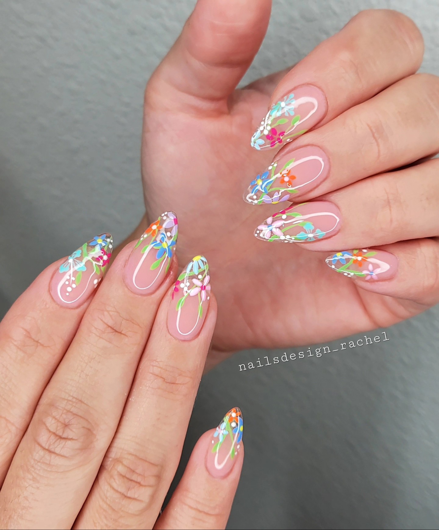 Colorful wildflowers on sheer almond nails