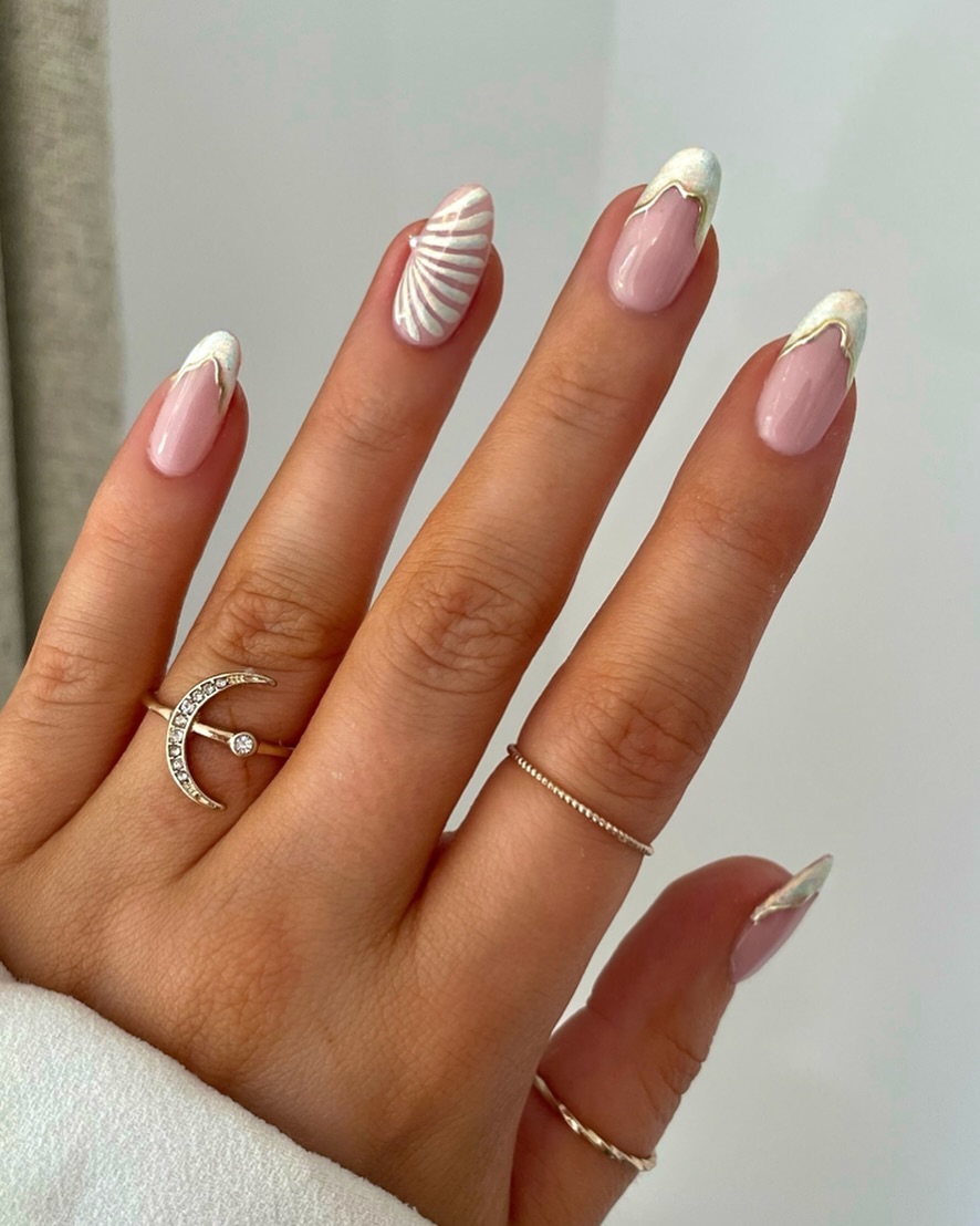 Blush almond nails with white seashell French tips
