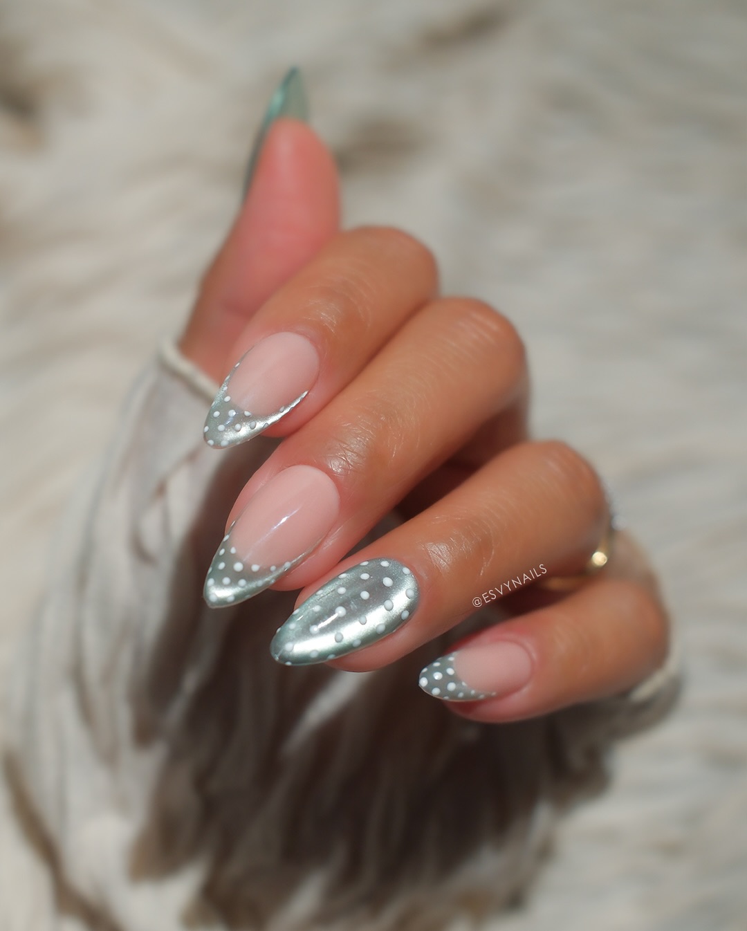 Silver chrome French tip almond nails with white dots