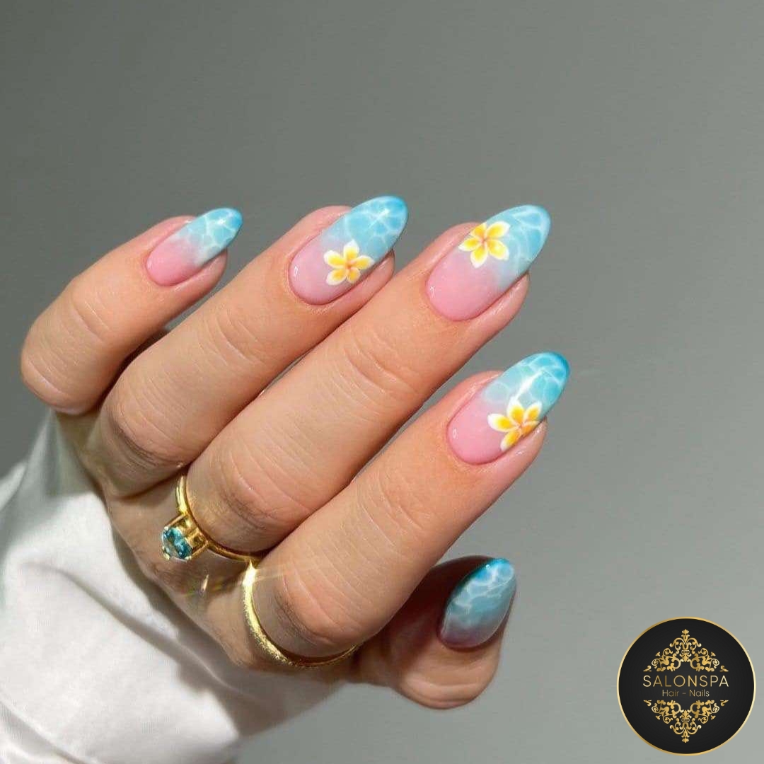 Sky blue ocean aura almond nails with yellow frangipani flowers