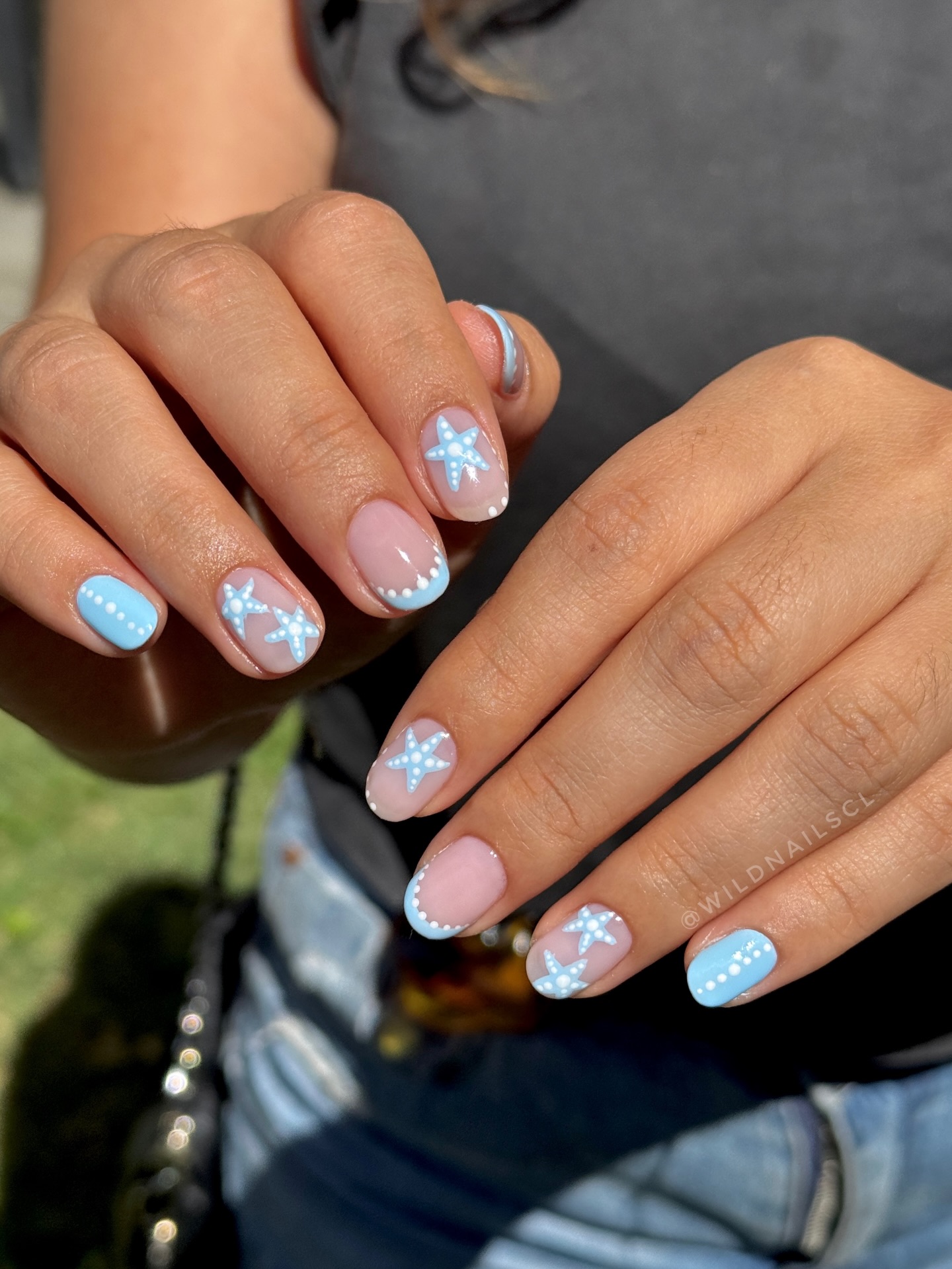 Blue starfish French tip nails