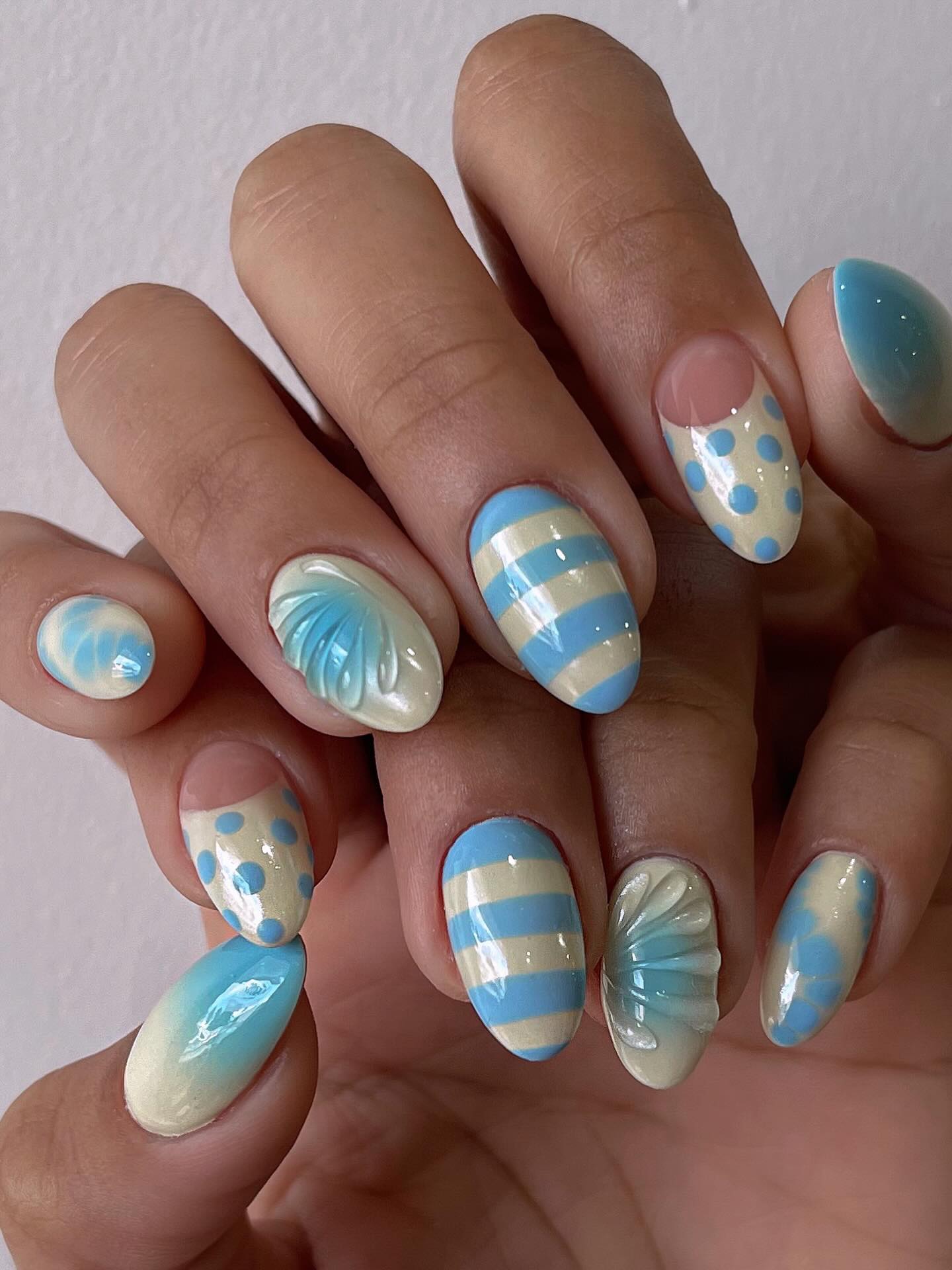 Sky blue swirl nail art