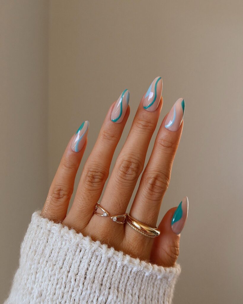 Long almond nails with translucent teal green swirl line art on a nude sheer base
