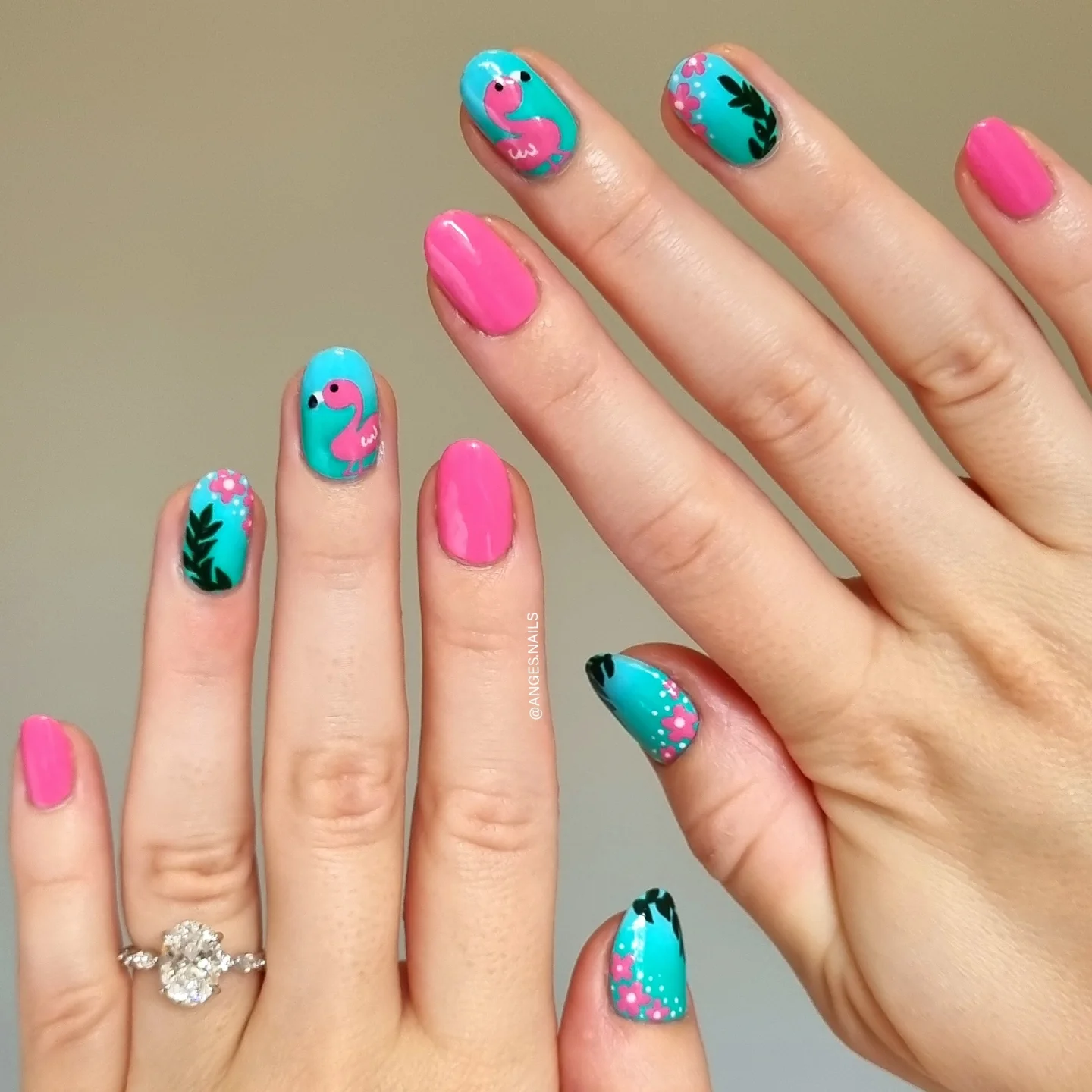 Teal and hot pink flamingo nails with tropical leaves and flowers